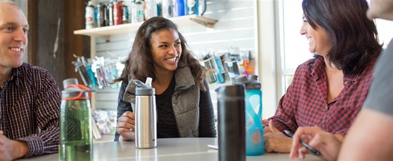 Camelbak-Staff-around-table-2-1280-525-TEST